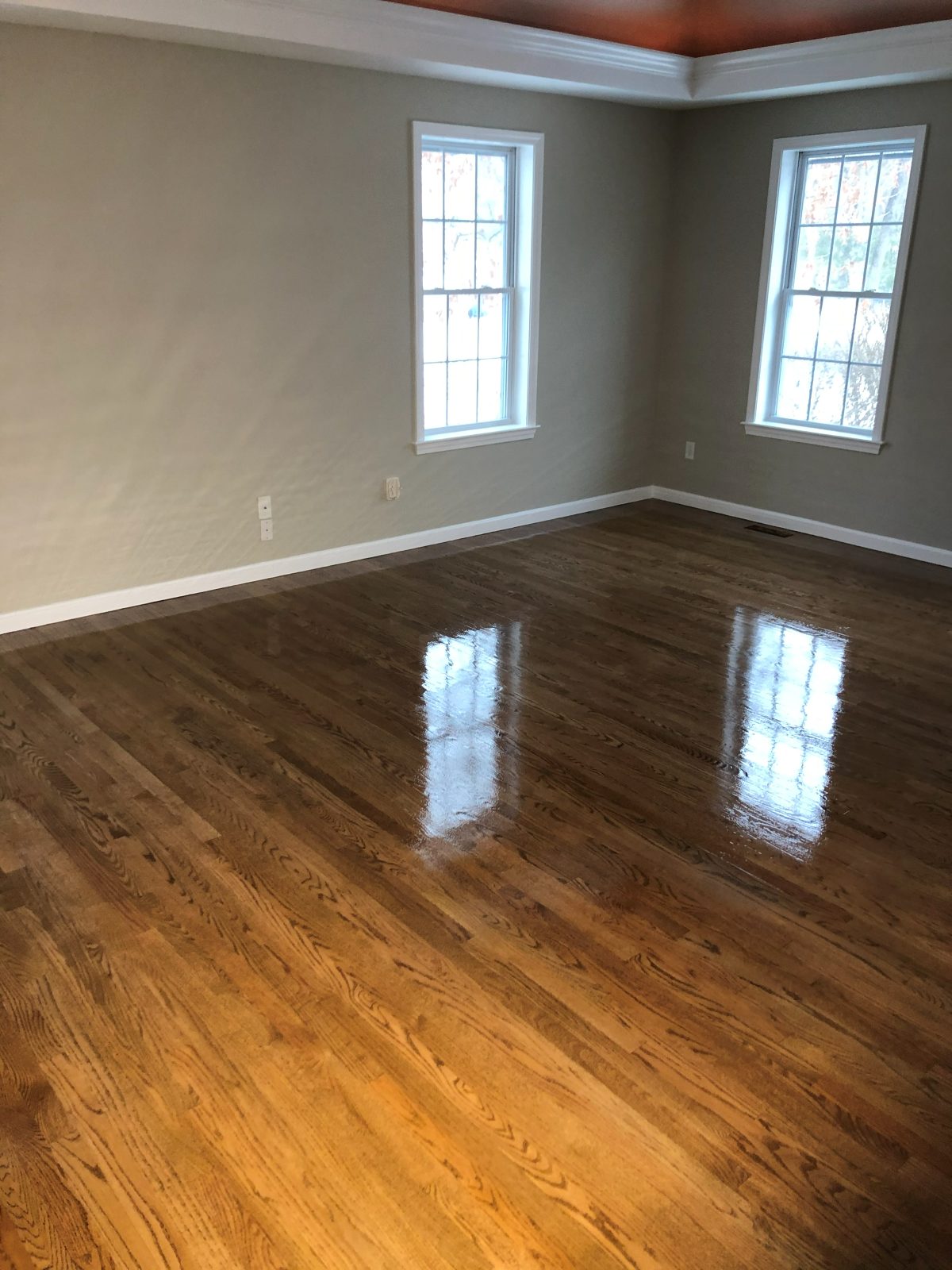 Finished hardwood floor with a glossy protective coat